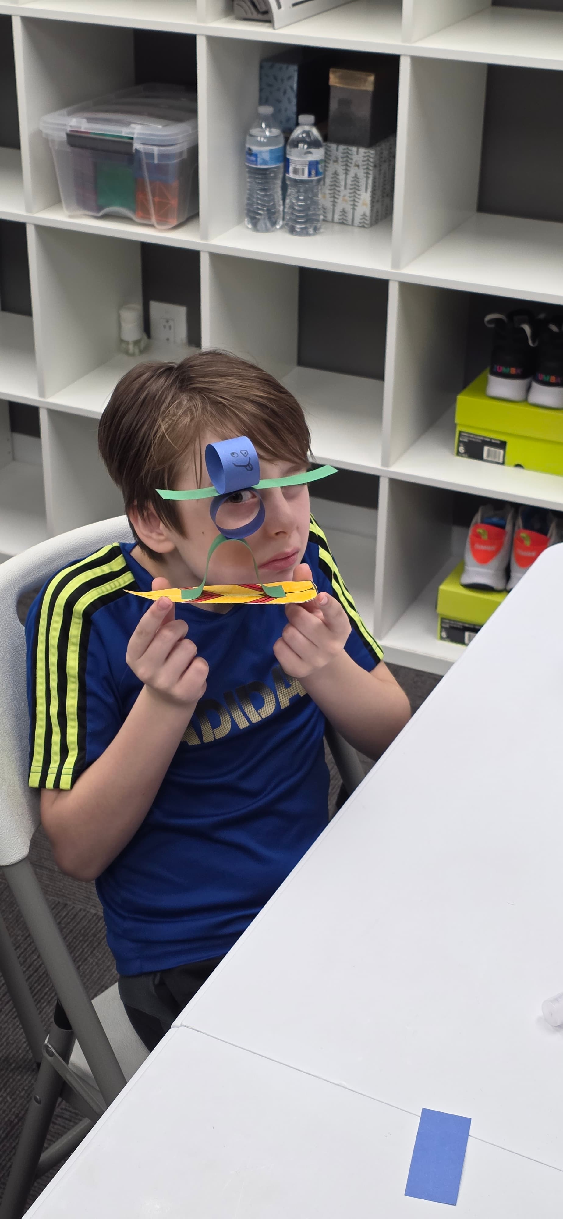 Camper working on a craft at the table