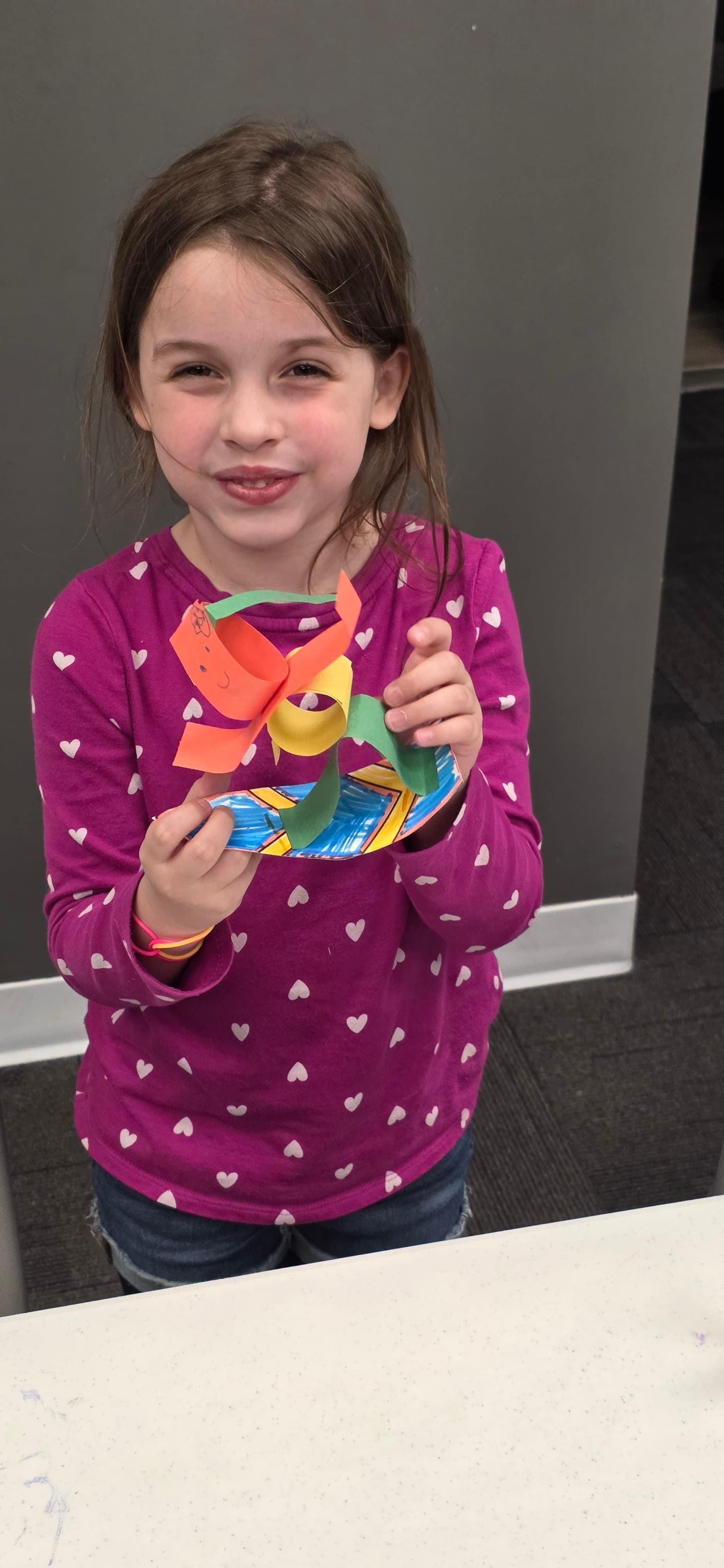 Camper smiling during an indoor activity
